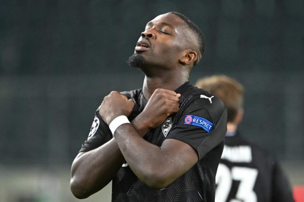 Moenchengladbach's French forward Marcus Thuram celebrates scoring the opening goal during the UEFA Champions League group B football match Borussia Moenchengladbach v Real Madrid in Moenchengladbach, western Germany on October 27, 2020. (Photo by Ina Fassbender / AFP)