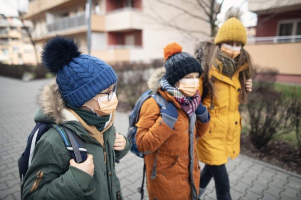 Three kids wearing anti virus masks. Kids are going to school. Shot with BMPCC4k with Q0 Raw