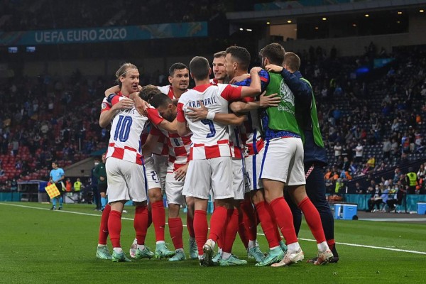 Croatia's players celebrate their third goal during the UEFA EURO 2020 Group D football match between Croatia and Scotland at Hampden Park in Glasgow on June 22, 2021. (Photo by Paul ELLIS / POOL / AFP)