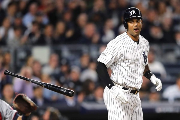 NEW YORK, NY - OCTOBER 03: Aaron Hicks #31 of the New York Yankees gets walked with bases loaded to score Aaron Judge #99 by Taylor Rogers #55 of the Minnesota Twins during the seventh inning in the American League Wild Card Game at Yankee Stadium on October 3, 2017 in the Bronx borough of New York City. Elsa/Getty Images/AFP== FOR NEWSPAPERS, INTERNET, TELCOS & TELEVISION USE ONLY ==