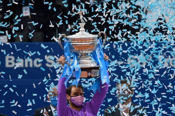 Spain's Rafael Nadal holds the trophy after winning the ATP Barcelona Open tennis tournament singles final match against Greece's Stefanos Tsitsipas at the Real Club de Tenis in Barcelona on April 25, 2021. (Photo by Josep LAGO / AFP)