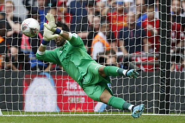 Manchester City's Chilean goalkeeper Claudio Bravo saves a penalty from Liverpool's Dutch midfielder Georginio Wijnaldum in the shoot-out during the English FA Community Shield football match between Manchester City and Liverpool at Wembley Stadium in north London on August 4, 2019. - Manchester City won the game 5-4 on penalties after the game finished 1-1. (Photo by Ian KINGTON / AFP) / NOT FOR MARKETING OR ADVERTISING USE / RESTRICTED TO EDITORIAL USE