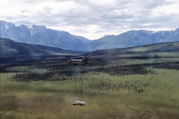 In this image courtesy of the Alaska Army National Guard, a National Guard Chinook helicopter lifts Fairbanks Bus 142, made famous by the book and film 'Into the Wild,' from the remote Stampede Trail outside Denali National Park, near Healy, Alaska, on June 18, 2020. - The bus was removed because of public safety concerns, since the remote and dangerous site had become a tourist attraction. The bus will be stored until a permanent site is found, according to the Alaska Department of Natural Resources. (Photo by Seth LACOUNT / Alaska Army National Guard / AFP) / RESTRICTED TO EDITORIAL USE - MANDATORY CREDIT 'AFP PHOTO / Alaska Army National Guard / Sgt. Seth LACOUNT' - NO MARKETING - NO ADVERTISING CAMPAIGNS - DISTRIBUTED AS A SERVICE TO CLIENTS