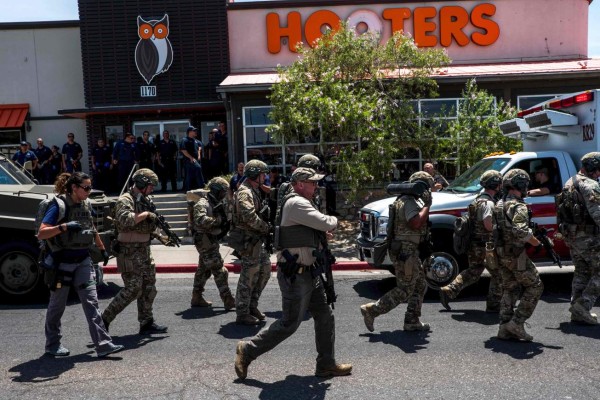 Law enforcement agencies respond to an active shooter at a Wal-Mart near Cielo Vista Mall in El Paso, Texas, Saturday, Aug. 3, 2019. - Police said there may be more than one suspect involved in an active shooter situation Saturday in El Paso, Texas. City police said on Twitter they had received 'multi reports of multipe shooters.' There was no immediate word on casualties. (Photo by Joel Angel JUAREZ / AFP)