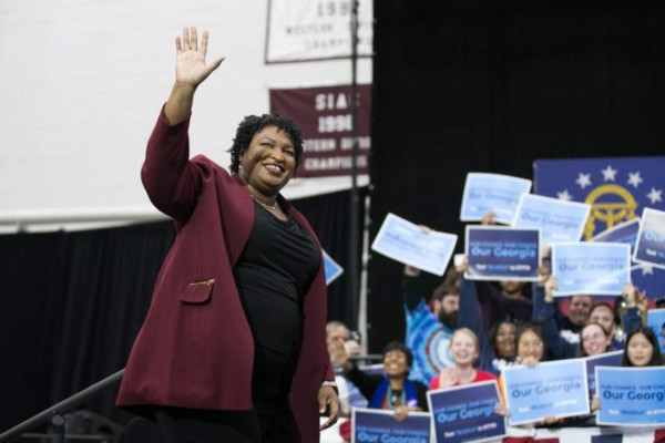 ATLANTA, GA - NOVEMBER 02: Georgia Democratic Gubernatorial candidate Stacey Abrams walks on stage and waves at the audience for a campaign rally at Morehouse College with Former US President Barack Obama on November 2, 2018 in Atlanta, Georgia. Obama spoke in Atlanta to endorse Abrams and encourage Georgians to vote. Jessica McGowan/Getty Images/AFP