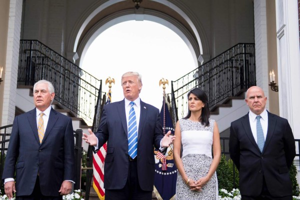 US President Donald Trump (C) speaks to the press with US Secretary of State Rex Tillerson (L), Ambassador to the United Nations Nikki Haley (2nd R) and United States National Security Advisor H. R. McMaster (R) on August 11, 2017, at Trump National Golf Club in Bedminster, New Jersey.Trump said Friday that he was considering options involving the US military as a response to the escalating political crisis in Venezuela. / AFP PHOTO / JIM WATSON