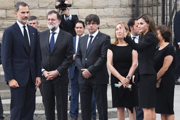 (From L) Spain's King Felipe VI, Spanish Prime Minister Mariano Rajoy, President of Catalonia Carles Puigdemont, Spanish vice-President of the Government and Minister of the Presidency and of the Regional Administrations Soraya Saenz de Santamaria, President of the Congress Ana Pastor and Spain's Queen Letizia arrive at the Sagrada Familia basilica in Barcelona on August 20, 2017, before a mass to commemorate victims of two devastating terror attacks in Barcelona and Cambrils.A grief-stricken Barcelona prepared today to commemorate victims of two devastating terror attacks at a mass in the city's Sagrada Familia church. As investigators scrambled to piece together the attacks which killed 14 people in all, Interior Minister Juan Ignacio Zoido said on August 19 the cell behind the carnage that also injured 120 and plunged the country into shock had been 'dismantled,' though local authorities took a more cautious tone. / AFP PHOTO / PASCAL GUYOT