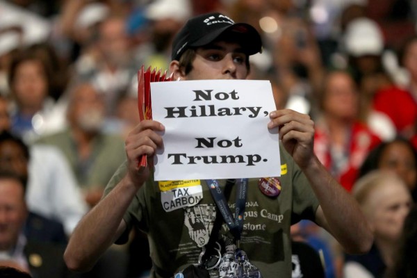 PHILADELPHIA, PA - JULY 25: An attendee holds up a sign that reads 'Not Hillary, Not Trump' during the opening of the first day of the Democratic National Convention at the Wells Fargo Center, July 25, 2016 in Philadelphia, Pennsylvania. An estimated 50,000 people are expected in Philadelphia, including hundreds of protesters and members of the media. The four-day Democratic National Convention kicked off July 25. Joe Raedle/Getty Images/AFP