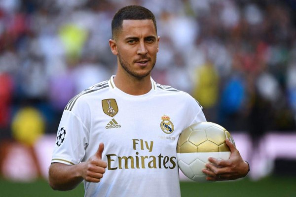 Belgian footballer Eden Hazard gives a thumbs-up during his official presentation as new player of the Real Madrid CF at the Santiago Bernabeu stadium in Madrid on June 13, 2019. (Photo by GABRIEL BOUYS / AFP)