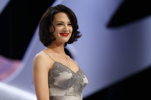 (FILES) This file photo taken on May 26, 2013 shows Italian actress Asia Argento on stage prior to handing the Best Screenplay award during the closing ceremony of the 66th Cannes film festival in Cannes. Italian actress Asia Argento, one of several women to accuse US movie mogul Harvey Weinstein of sexual abuse, has now accused a Hollywood director of rape. 'Hollywood big shot director with Napoleon complex gave me GHB (the 'date rape' drug) and raped me unconscious. I was 26 years old,' she said in a Tweet that caused outrage in Italy on October 16, 2017. / AFP PHOTO / VALERY HACHE