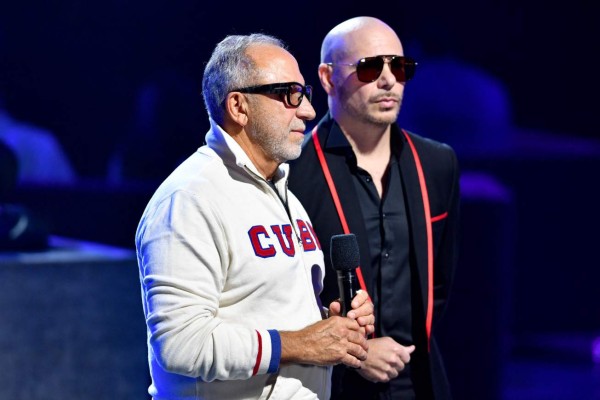 CORAL GABLES, FLORIDA - JULY 22: Emilio Estefan and Pitbull speak onstage at Premios Juventud 2021 at Watsco Center on July 22, 2021 in Coral Gables, Florida. Jason Koerner/Getty Images for Univision/AFP (Photo by Jason Koerner / GETTY IMAGES NORTH AMERICA / Getty Images via AFP)