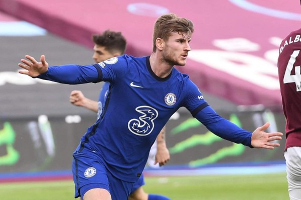 Chelsea's German striker Timo Werner celebrates after scoring the opening goal of the English Premier League football match between West Ham United and Chelsea at The London Stadium, in east London on April 24, 2021. (Photo by Andy Rain / POOL / AFP) / RESTRICTED TO EDITORIAL USE. No use with unauthorized audio, video, data, fixture lists, club/league logos or 'live' services. Online in-match use limited to 120 images. An additional 40 images may be used in extra time. No video emulation. Social media in-match use limited to 120 images. An additional 40 images may be used in extra time. No use in betting publications, games or single club/league/player publications. /