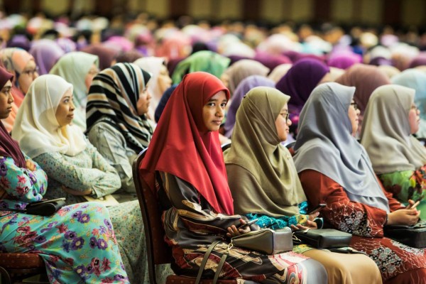 Muslim women listen to Brunei's Sultan Hassanal Bolkiah's speech during an event in Bandar Seri Begawan on April 3, 2019. - Brunei's sultan called for Islamic teachings in the country to be strengthened as strict new sharia punishments, including death by stoning for gay sex and adultery, were due to come into force on April 3. (Photo by - / AFP) / Brunei OUT