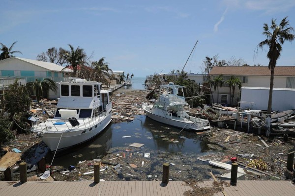 MARATHON, FL - SEPTEMBER 12: Boats, cars and other debris clog waterways in the Florida Keys two days after Hurricane Irma slammed into the state September 12, 2017 in Marathon, Florida. The Federal Emergency Managment Agency has reported that 25-percent of all homes in the Florida Keys were destroyed and 65-percent sustained major damage when they took a direct hit from Hurricane Irma. Chip Somodevilla/Getty Images/AFP