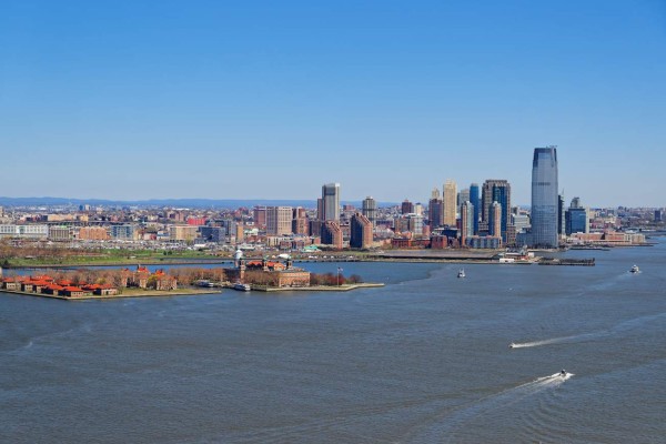 Aerial view of the Governors Island in the New York City harbor on a clear spring day with Brooklyn vision in the background