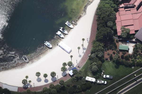 ORLANDO, FL - JUNE 15: Search and rescue boats are seen on a beach near the Walt Disney World's Grand Floridian resort hotel where a 2-year-old boy was taken by an alligator as he waded in the waters of the Seven Seas Lagoon on June 15, 2016 in Orlando, Florida. The child was taken last night at about 9 pm and the search and rescue effort has become a recovery effort. Joe Raedle/Getty Images/AFP== FOR NEWSPAPERS, INTERNET, TELCOS & TELEVISION USE ONLY ==