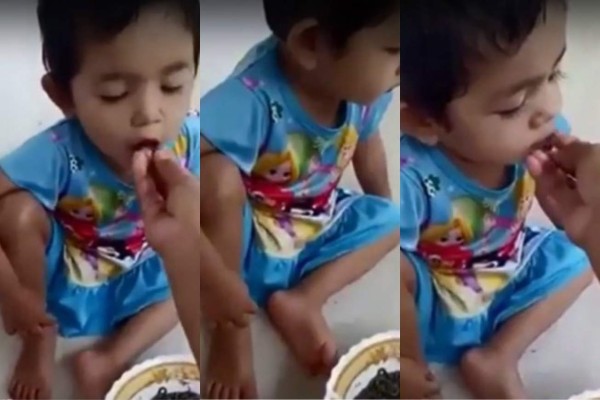 Video de una madre que da de comer gusanos vivos a su hija