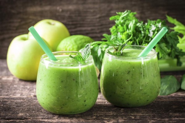 green Detox smoothie on wooden table