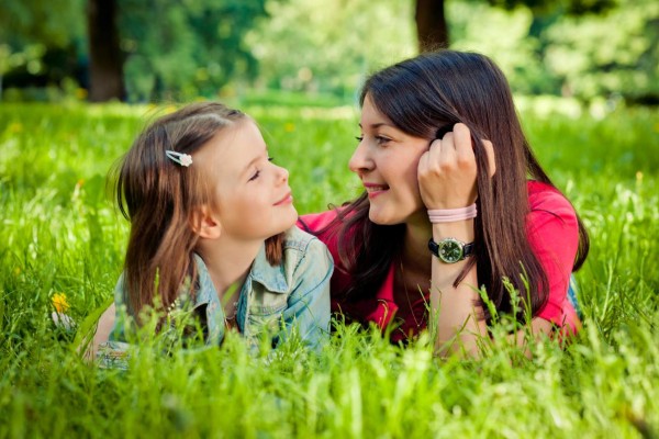 Mother and daughter in summer park