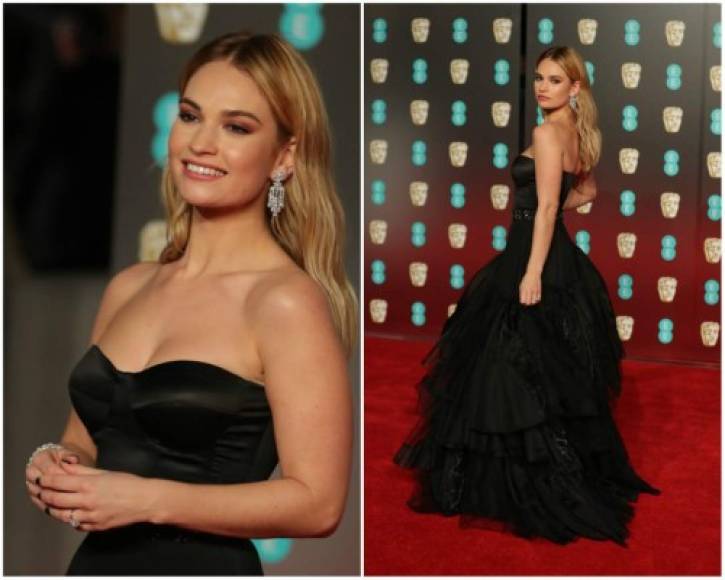 Lily James. Con su aspecto de princesa, la actriz de la Cenicienta lució un corpiño de seda sin tirantes que complementaba con un cinturón con adornos de cristal negro.<br/>