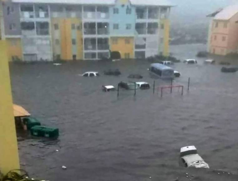 A handout picture released on September 6, 2017 on the twitter accound of RCI Guadeloupe shows a flooded street on the French overseas island of Saint-Martin, after high winds from Hurricane Irma hit the island. <br/>Monster Hurricane Irma slammed into Caribbean islands today after making landfall in Barbuda, packing ferocious winds and causing major flooding in low-lying areas. As the rare Category Five storm barreled its way across the Caribbean, it brought gusting winds of up to 185 miles per hour (294 kilometers per hour), weather experts said. / AFP PHOTO / RCI Guadeloupe AND TWITTER / Rinsy XIENG / RESTRICTED TO EDITORIAL USE - MANDATORY CREDIT 'AFP PHOTO / RCI Guadeloupe / Rinsy XIENG' - NO MARKETING NO ADVERTISING CAMPAIGNS - DISTRIBUTED AS A SERVICE TO CLIENTS - NO INTERNET - NO RESALE - IMAGE AVAILABLE AS PART OF A 48-HOUR RIGHT TO INFORMATION FROM WEDNESDAY 6TH OF SEPTEMBER 2017 8PM GMT<br/> /