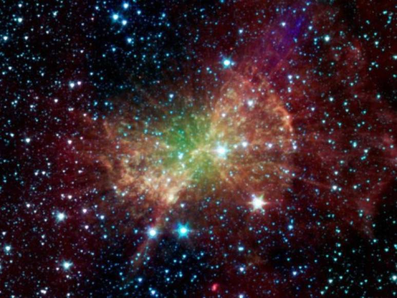 Nebulosa Dumbell. <br/><br/>La nebulosa Dumbbell, también conocida como Messier 27, nebulosa de la Haltera o nebulosa de la Manzana, bombea la luz infrarroja en esta imagen de la NASA. <br/>Se trata de una nebulosa planetaria localizada en la constelación de Vulpecula o La zorra, a unos 1.360 años luz de distancia de la Tierra. Es una de las mayores nebulosas planetarias conocidas.