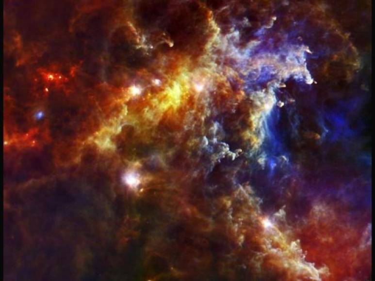 Nebulosa Roseta.<br/><br/>Esta imagen del Observatorio Espacial ESA Herschel muestra una parte de la nebulosa Roseta, un vivero estelar a unos 5.000 años luz de la Tierra en una gigantesca nube molecular en la constelación de Monoceros o del Unicornio. <br/><br/>Como está situada en la banda de la Vía Láctea, el cúmulo de estrellas abierto dentro de la nebulosa es visible con binoculares.