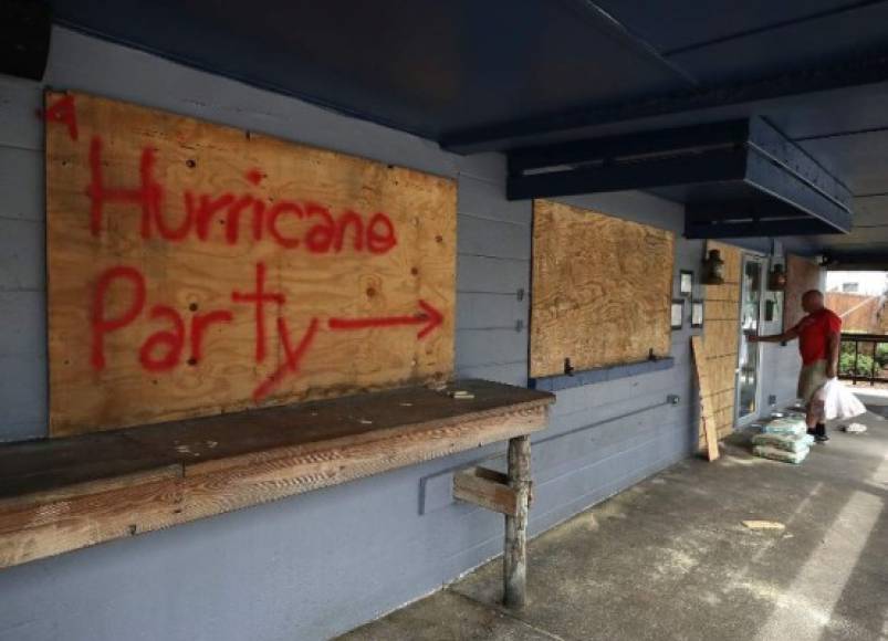 WRIGHTSVILLE BEACH, NC- SEPTEMBER 11: Hurricane Party is written on plywood covering the window of the Lager Heads Tavern as they prepare for the arrival of Hurricane Florence on September 11, 2018 in Wrightsville Beach, United States. Hurricane Florence is expected on Friday possibly as a category 4 storm along the Virginia, North Carolina and South Carolina coastline. Mark Wilson/Getty Images/AFP