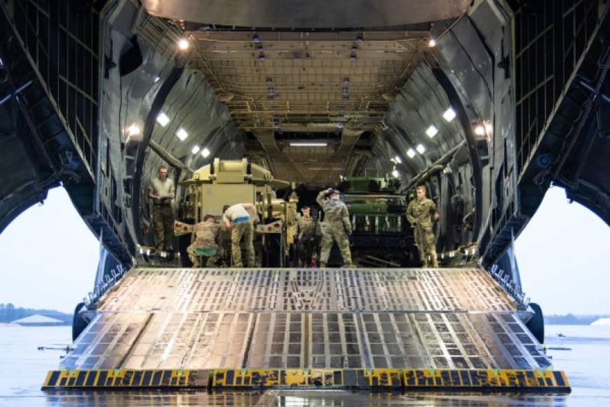 In this image released by the US Defense Department, equipment assigned to 1st Brigade Combat Team, 82nd Airborne Division is loaded into aircraft bound for the US Central Command area of operations from Fort Bragg, North Carolina on January 4, 2020. - This deployment is a precautionary action taken to respond to increased threat levels against US personnel and facilities. Thousands more US troops were ordered to the Middle East on January 3 after the US assassinated Iran's military mastermind and Tehran promised 'severe revenge.' (Photo by Zachary VANDYKE / US Department of Defense / AFP) / RESTRICTED TO EDITORIAL USE - MANDATORY CREDIT 'AFP PHOTO / US Army Photo / US Army /ZACHARY VANDYKE' - NO MARKETING - NO ADVERTISING CAMPAIGNS - DISTRIBUTED AS A SERVICE TO CLIENTS