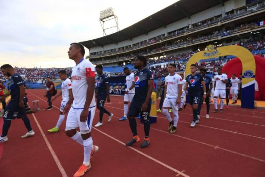 El clásico capitalino se realizó en el estadio Olímpico de San Pedro Sula y era pendiente de la jornada 5 de la primera vuelta. Olimpia llegaba presionado al juego tras la debacle en la Liga Concacaf ante Saprissa.