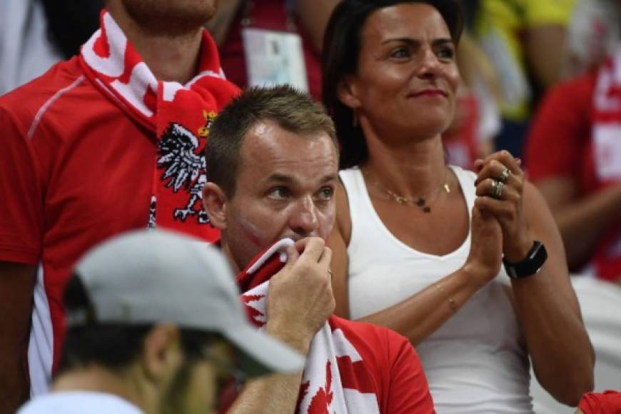 La tristeza de los aficionados de Polonia. Foto AFP