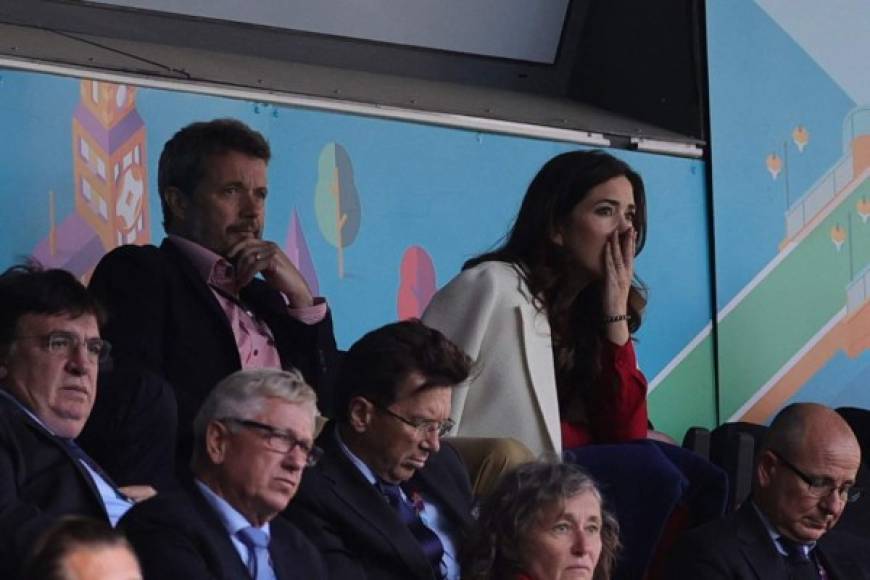 Crown Prince Frederik and Crown Princess Mary of Denmark react after Denmark's midfielder Christian Eriksen collapsed on the pitch during the UEFA EURO 2020 Group B football match between Denmark and Finland at the Parken Stadium in Copenhagen on June 12, 2021. (Photo by Friedemann Vogel / POOL / AFP)