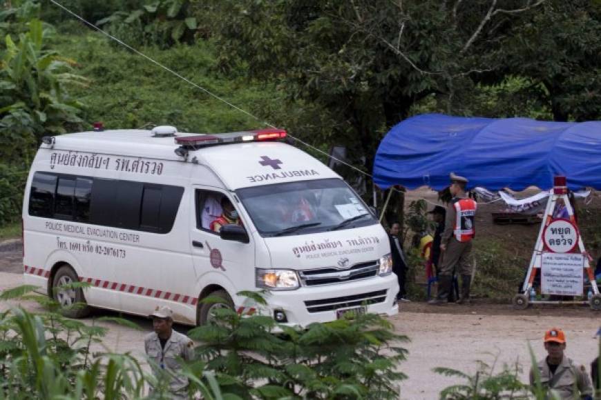 An ambulance leaves the Tham Luang cave area as operations continue for those still trapped inside the cave in Khun Nam Nang Non Forest Park in the Mae Sai district of Chiang Rai province on July 10, 2018.<br/>Rescuers raced to save four young footballers and their coach who remain trapped in a flooded Thai cave on July 10, as heavy rains threatened an already perilous escape mission that has seen eight of the boys extracted in 'good health'. / AFP PHOTO / YE AUNG THU