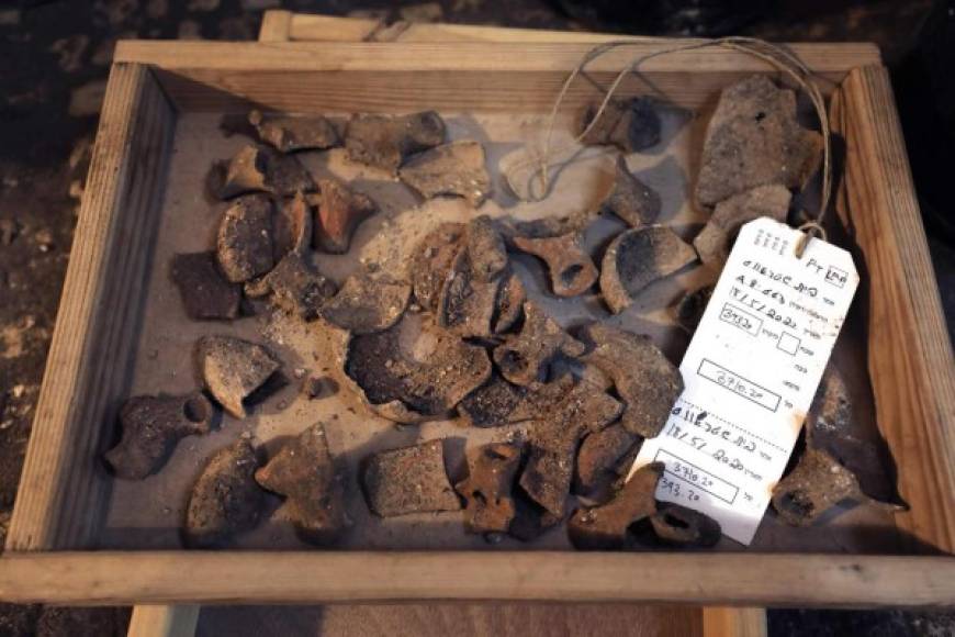 This picture taken on May 19, 2020 shows a view of ceramic fragments of oil lamps dating to the Jewish Second Temple period (6th century BCE-1st century CE), discovered at a subterranean system hewn in the bedrock beneath a 1400-year-old building near the Western Wall in Jerusalem's Old City. (Photo by MENAHEM KAHANA / AFP)