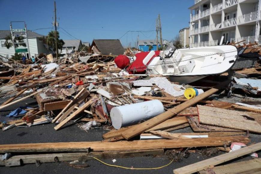 MEXICO BEACH, FL - OCTOBER 11: Debris is seen piled in the street after Hurricane Michael passed through the area on October 11, 2018 in Mexico Beach, Florida. The hurricane hit the panhandle area with category 4 winds causing major damage. Joe Raedle/Getty Images/AFP