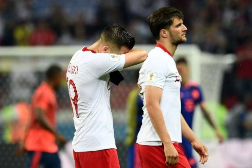 La tristeza de los jugadores de Polonia al final del partido. Foto AFP