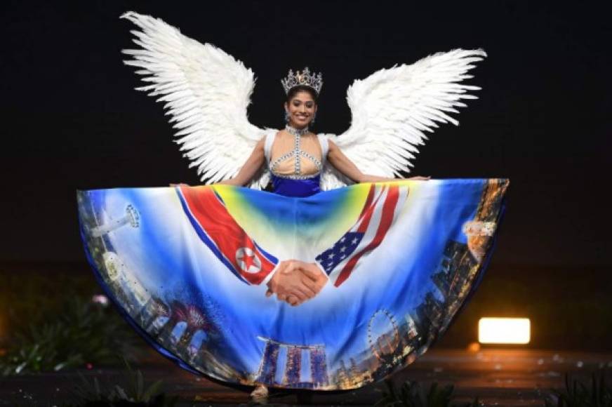 Zahra Khanum, Miss Singapore 2018 walks on stage during the 2018 Miss Universe national costume presentation in Chonburi province on December 10, 2018. (Photo by Lillian SUWANRUMPHA / AFP)