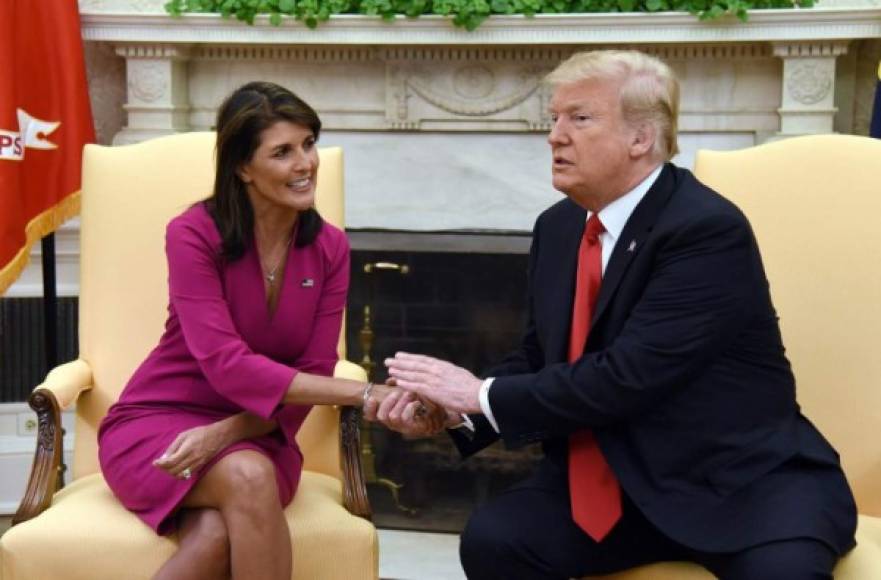 US President Donald Trump shakes hands with Nikki Haley, the United States Ambassador to the United Nations in the Oval office of the White House on October 9, 2018 in Washington, DC. <br/>Nikki Haley resigned Tuesday as the US ambassador to the United Nations, in the latest departure from President Donald Trump's national security team. Meeting Haley in the Oval Office, Trump said that Haley had done a 'fantastic job' and would leave at the end of the year.<br/> / AFP PHOTO / Olivier Douliery