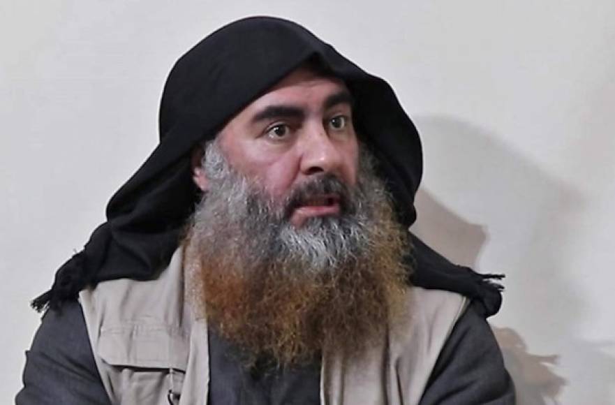 (FILES) In this file photo taken on April 30, 2019 In this undated tv grab taken from a video released by Al-Furqan media, the chief of the Islamic State group Abu Bakr al-Baghdadi purportedly appears for the first time in five years in a propaganda video in an undisclosed location. - Baghdadi was believed to be dead after a US military raid in Syria's Idlib region, US media reported early on October 27, 2019. (Photo by - / various sources / AFP) / THIS PICTURE WAS MADE AVAILABLE BY A THIRD PARTY. AFP CAN NOT INDEPENDENTLY VERIFY THE AUTHENTICITY, LOCATION, DATE AND CONTENT OF THIS IMAGE. THIS PHOTO IS DISTRIBUTED EXACTLY AS RECEIVED BY AFP. RESTRICTED TO EDITORIAL USE - MANDATORY CREDIT 'AFP PHOTO / SOURCE / AL-FURQAN' - NO MARKETING - NO ADVERTISING CAMPAIGNS - DISTRIBUTED AS A SERVICE TO CLIENTS / ALTERNATIVE CROP