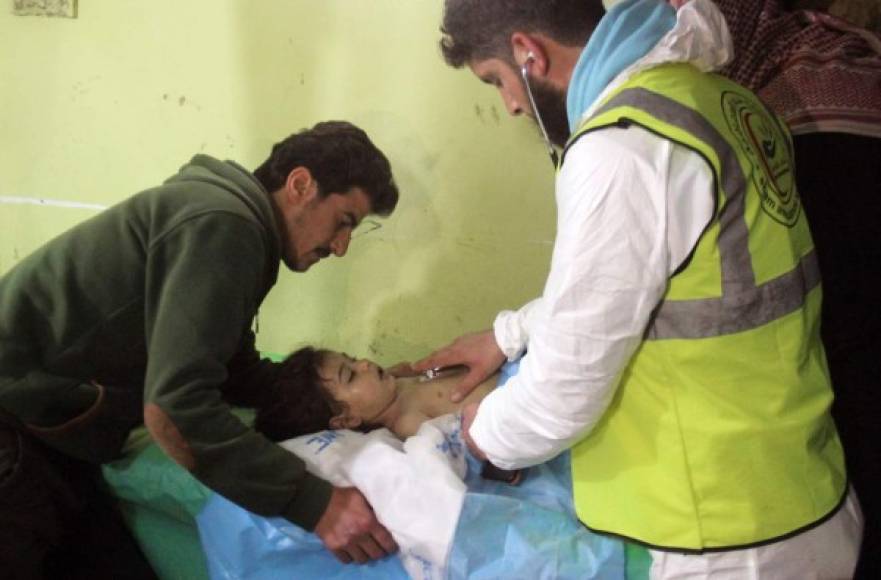 An unconscious Syrian child receives treatment at a hospital in Khan Sheikhun, a rebel-held town in the northwestern Syrian Idlib province, following a suspected toxic gas attack on April 4, 2017.<br/><br/>A suspected chemical attack killed at least 58 civilians including several children in rebel-held northwestern Syria, a monitor said, with the opposition accusing the government and demanding a UN investigation. / AFP PHOTO / Omar haj kadour