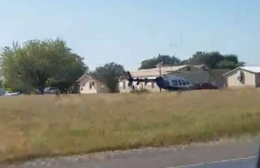 In this screen grab taken from a Facebook video released by user Jordan Steubing, a helicopter is seen in a field near a church in Sutherland Springs, Texas on November 5, 2017.<br/>A gunman shot dead at least 20 worshippers attending Sunday morning services at a Baptist church in Texas, news media reported. / AFP PHOTO / FACEBOOK / Jordan Steubing / RESTRICTED TO EDITORIAL USE - MANDATORY CREDIT 'AFP PHOTO / FACEBOOK/ JORDAN STEUBING' - NO MARKETING NO ADVERTISING CAMPAIGNS - DISTRIBUTED AS A SERVICE TO CLIENTS == NO ARCHIVE<br/>