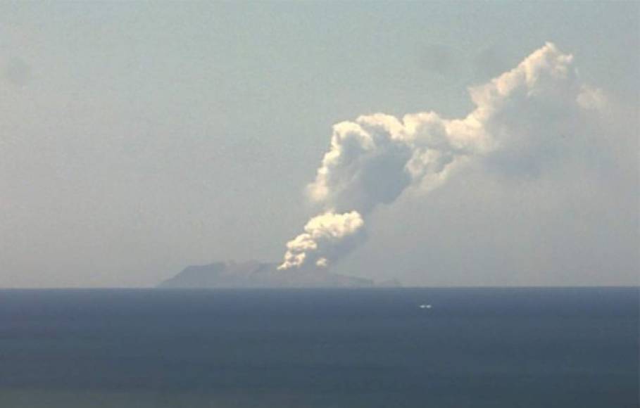 This handout image from a webcam belonging to the Institute of Geological and Nuclear Sciences shows the volcano on New Zealand's White Island spewing steam and ash on December 9, 2019. - At least one person was left in a critical condition when New Zealand's White Island volcano erupted suddenly on December 9, leaving authorities scrambling to treat the injured and find those unaccounted for. (Photo by Handout / Institute of Geological and Nuclear Sciences Ltd / AFP) / RESTRICTED TO EDITORIAL USE - MANDATORY CREDIT 'AFP PHOTO / INSTITUTE OF GEOLOGICAL AND NUCLEAR SCIENCES LTD' - NO MARKETING NO ADVERTISING CAMPAIGNS - DISTRIBUTED AS A SERVICE TO CLIENTS