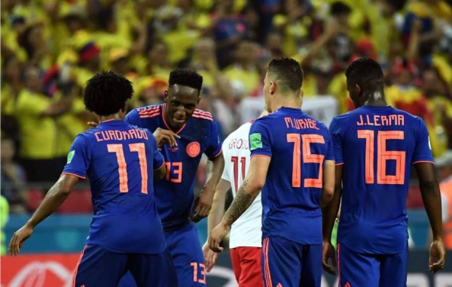 El festejo de Juan Guillermo Cuadrado y Yerry Mina con bailecito incluido. Foto AFP