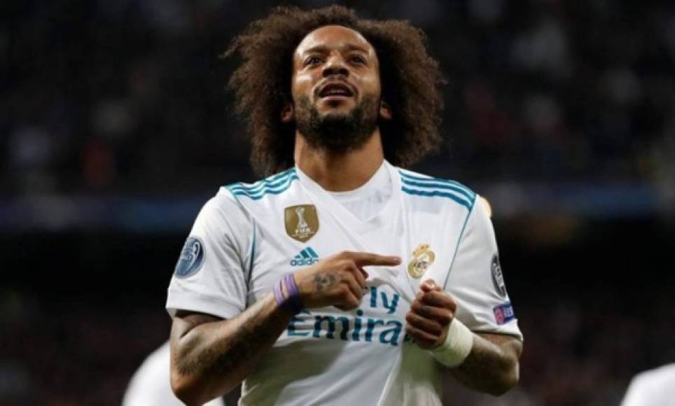 Real Madrid's Brazilian defender Marcelo scores during the Spanish league football match Real Madrid CF against Levante UD at the Santiago Bernabeu stadium in Madrid on October 20, 2018. (Photo by GABRIEL BOUYS / AFP)