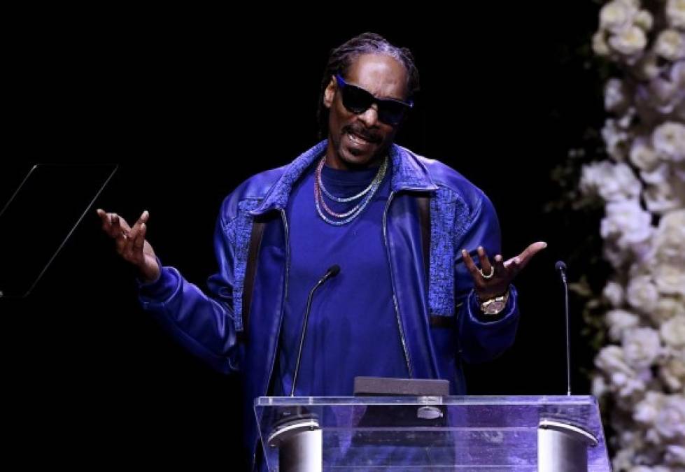 US rapper Snoop Dogg speaks onstage during the Celebration of Life memorial service for late US rapper, recording artist and social activist Nipsey Hussle, at the Staples Center on April 11, 2019 in Los Angeles. - Hussle, born Ermias Ashgedom, was fatally shot outside his Marathon Clothing store in South Los Angeles on March 31, 2019. (Photo by Kevork Djansezian / POOL / AFP)