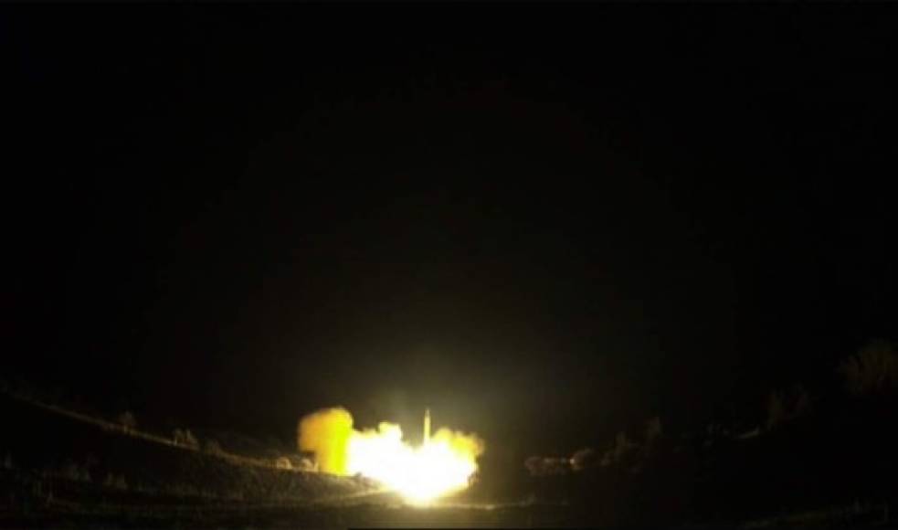An image grab from footage obtained from the state-run Iran Press news agency on January 8, 2020 allegedly shows rockets launched from the Islamic republic against the US military base in Ein-al Asad in Iraq the prevous night. - Iran fired a volley of missiles late on January 7, 2020 at Iraqi bases housing US and foreign troops in Iraq, the Islamic republic's first act in its promised revenge for the US killing of a top Iranian general. Launched for the first time by government forces inside Iran instead of by proxy, the attack marked a new turn in the intensifying confrontation between Washington and Tehran and sent world oil prices soaring. (Photo by - / IRAN PRESS / AFP) / RESTRICTED TO EDITORIAL USE - MANDATORY CREDIT - AFP PHOTO / HO / IRAN PRESS NO MARKETING NO ADVERTISING CAMPAIGNS - DISTRIBUTED AS A SERVICE TO CLIENTS FROM ALTERNATIVE SOURCES, AFP IS NOT RESPONSIBLE FOR ANY DIGITAL ALTERATIONS TO THE PICTURE'S EDITORIAL CONTENT, DATE AND LOCATION WHICH CANNOT BE INDEPENDENTLY VERIFIED - NO RESALE - NO ACCESS ISRAEL MEDIA/PERSIAN LANGUAGE TV STATIONS/ OUTSIDE IRAN/ STRICTLY NI ACCESS BBC PERSIAN/ VOA PERSIAN/ MANOTO-1 TV/ IRAN INTERNATIONAL /