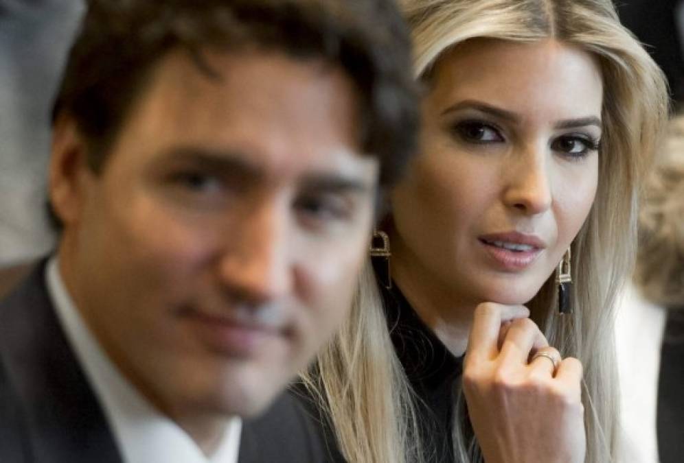 Canadian Prime Minister Justin Trudeau sits alongside Ivanka Trump (R), daughter of US President Donald Trump, during a roundtable discussion on women entrepreneurs and business leaders in the Cabinet Room of the White House in Washington, DC, February 13, 2017. / AFP PHOTO / SAUL LOEB