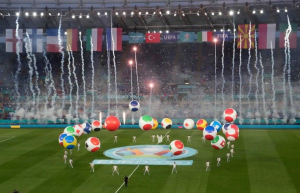 Entertainers perform during the opening ceremony before the UEFA EURO 2020 Group A football match between Turkey and Italy at the Olympic Stadium in Rome on June 11, 2021. (Photo by Andrew Medichini / POOL / AFP)
