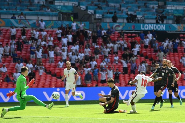 England's forward Raheem Sterling (2ndR) scores his team's first goal during the UEFA EURO 2020 Group D football match between England and Croatia at Wembley Stadium in London on June 13, 2021. (Photo by Glyn KIRK / POOL / AFP)