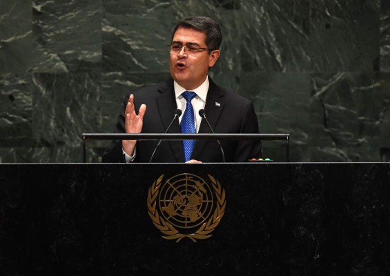 President of Honduras Juan Orlando Hernandez Alvarado speaks at the 74th Session of the General Assembly at the United Nations headquarters on September 25, 2019 in New York. (Photo by TIMOTHY A. CLARY / AFP)